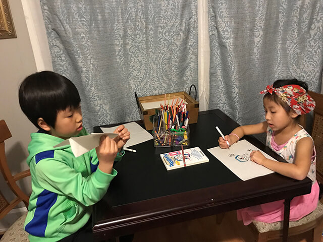 children sitting at a desk