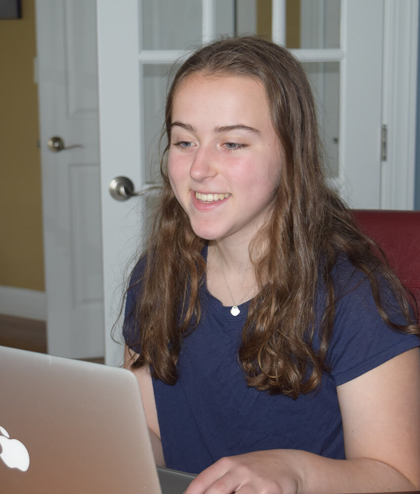 young girl using a laptop
