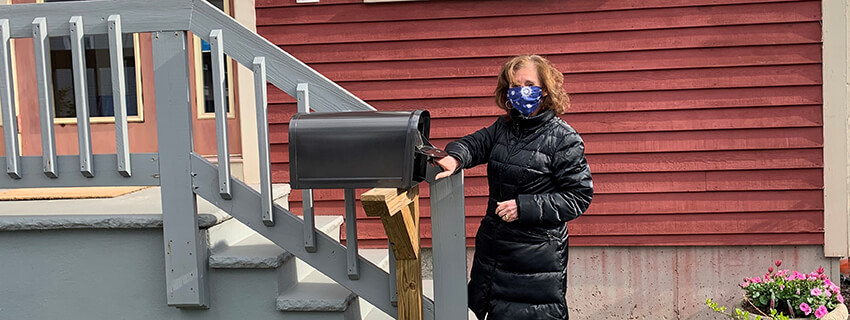 woman at mailbox