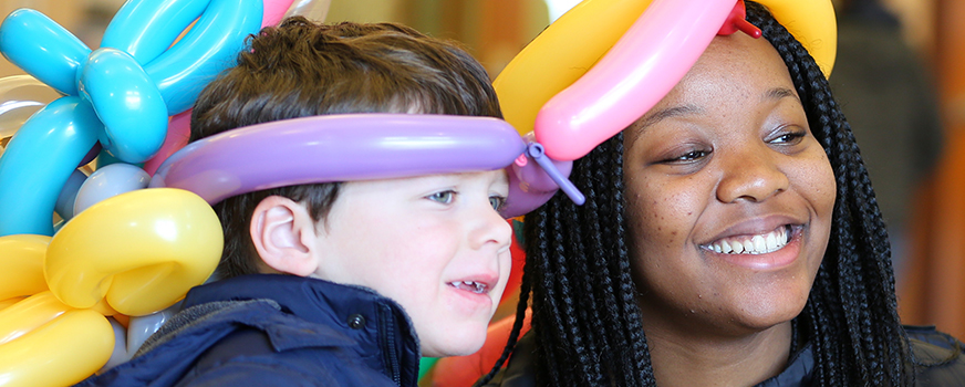 woman and child with ballon hats