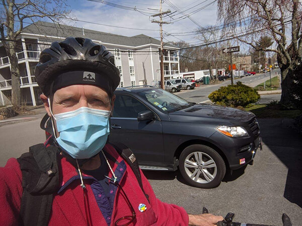 man on bike wearing a mask